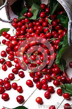 Scattered cherry from basket. Cherries in basket on white background. Healthy, summer fruit. Cherries. Close up. Stock Photo