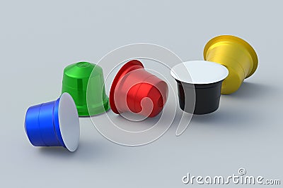 Scattered colorful coffee capsules on gray background. Modern decaf pods for machine. Stock Photo