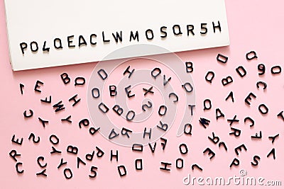Scattered letters, alphabet on pink background, write, read, grammar concept, Choose a security password Stock Photo