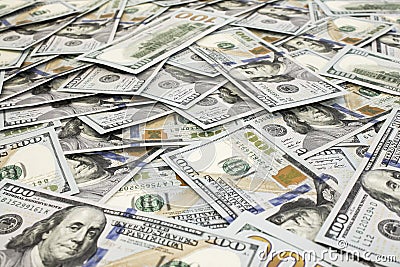 Scattered one hundred dollas banknotes close up background Stock Photo