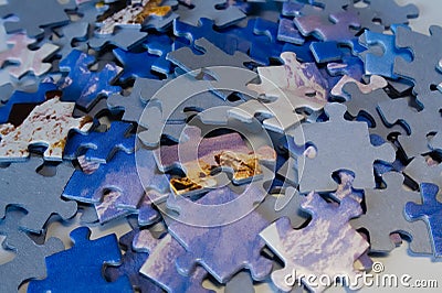 Scattered puzzle pieces with blue motive Stock Photo