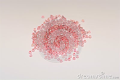 Scattered shiny rose seed beads Stock Photo
