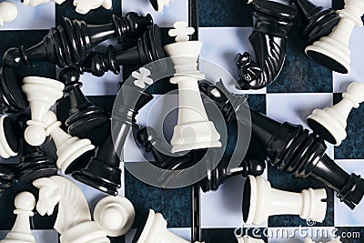 Scattering black and white chess pieces chessboard Stock Photo