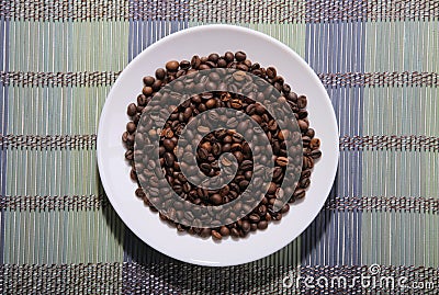 A scattering of coffee beans on a plate Stock Photo