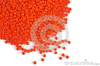 A scattering of orange beads on a white isolated background Stock Photo