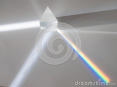 Scattering of a ray of sunlight white light through a prism creating refraction Stock Photo