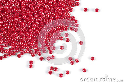 A scattering of red beads on a white isolated background Stock Photo