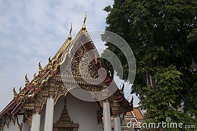 Thai temple with ornate pediment and roof Stock Photo