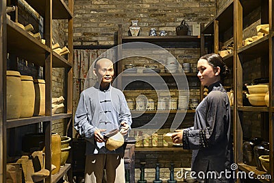 Scene of China traditional ceramic shop interior,wax figure Editorial Stock Photo