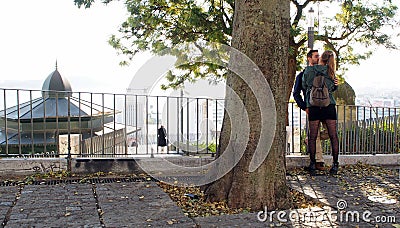 Scene with a couple, at the terrace overlooking the city, Lisbon, Portugal Editorial Stock Photo