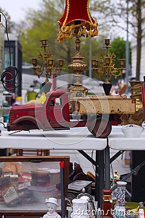 Scene from Flea market where people sell and buy used toys, clothes, pictures, kitchen ware and other vintage things Stock Photo