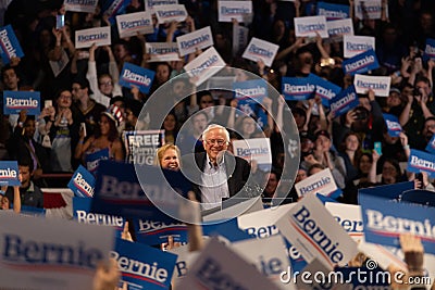 Scene from the heated rally of Bernie Sanders with the crowd holding banners actively cheering Editorial Stock Photo