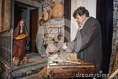 Scene of Jesus life. Picture of the Family. Joseph engaged in processing wood Editorial Stock Photo