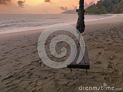 Scene of the singe rope tree swing at the seaside Stock Photo