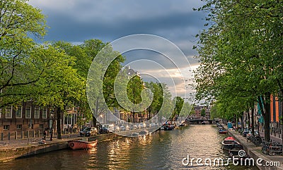 A sunset in a channel of Amsterdam Editorial Stock Photo