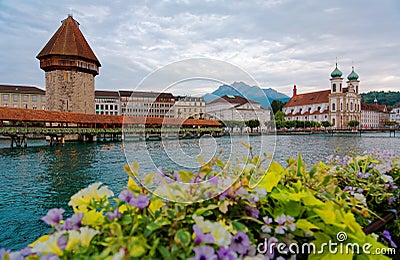 Scenery of Chapel Bridge Kapellbrucke over Reuss River in Lucern, Switzerland, with Water Towe Stock Photo