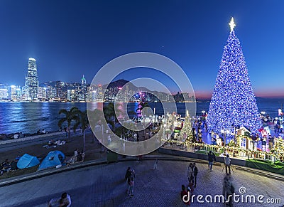 Scenery of Christmas tree and decoration with skyline of Victoria harbor of Hong Kong city Stock Photo