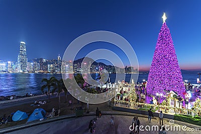 Scenery of Christmas tree and decoration with skyline of Victoria harbor of Hong Kong city Stock Photo