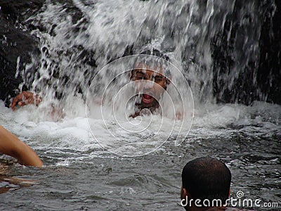 A holiday bath under a waterfall Editorial Stock Photo