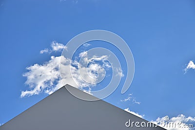 Scenery of sunny blue sky and triangular roof Stock Photo