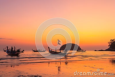 Scenery sunset above fishing boats at Kata beach Stock Photo
