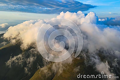 Scenic clouds on the mountain ridge Stock Photo