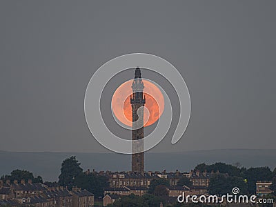 Scenic display of the Wainhouse tower against the bright sun captured at sunset in Hailfax Stock Photo