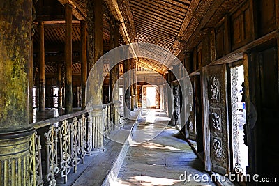 Scenic Hallway of the Ancient Shwenandaw Buddhist Monastery in Mandalay, Myanmar in Summer Stock Photo