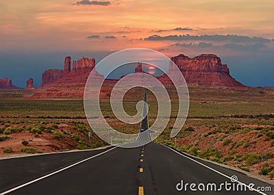 Scenic highway in Monument Valley Tribal Park in Arizona-Utah border, U.S.A. at sunset. Stock Photo