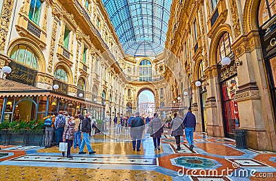 The scenic interior of Galleria Vittorio Emanuele II with luxury boutiques and restaurants, Milan, Italy Editorial Stock Photo