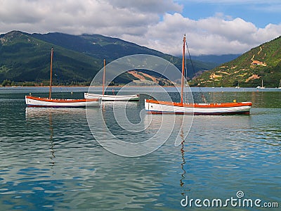 Scenic Kenepuru Sound images clinker sailing boats with masts moored together Stock Photo