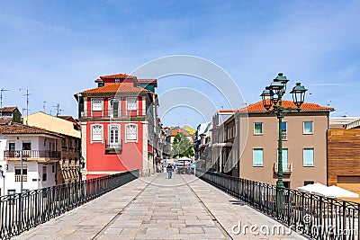 scenic narrow street in Chaves in early morning light with cobble stones and old historic houses Editorial Stock Photo