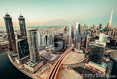 Scenic panoramic view of modern city at sunset. Aerial skyline of Dubai, UAE Stock Photo
