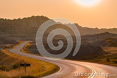 Scenic road at sunset in Badlands National Park. Stock Photo