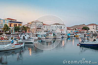 Myrina, Lemnos island, Greece the magical touristic Greek islands at sunset. Port of Limnos panoramic view at dusk. Long exposure Stock Photo