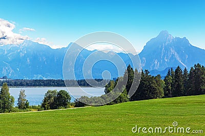 Scenic summer landscape with mountains, lake and forest Stock Photo