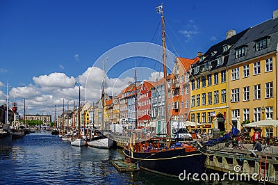 Scenic summer view of Nyhavn pier with old buildings, ships Editorial Stock Photo