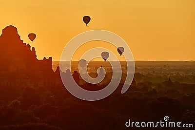 Scenic sunrise with many hot air balloons above Bagan in Myanmar Stock Photo