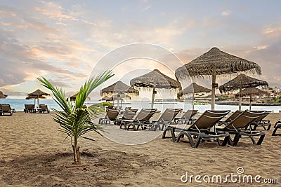 Scenic sunset on sandy beach Playa de Torviscas - Tenerife, Canary Islands. Stock Photo