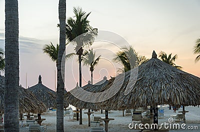 Scenic sunset view across the hotels thatch tents Editorial Stock Photo