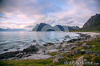 Scenic sunset view on beach, ocean and mountains, Lofoten, Norway Editorial Stock Photo