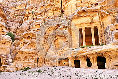 Scenic View Ancient Rock-Cut Colonnaded Triclinium and Staircase Ruins in Little Petra, Jordan Stock Photo