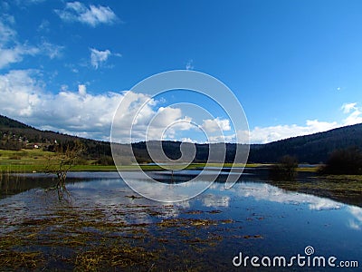 Scenic view of beautiful lake Cerknica or Cerknisko jezero in Notranjska Stock Photo