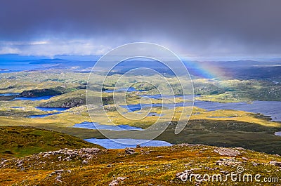Scenic view of beautiful lakes, clouds and rainbow in Inverpolly area, Scotland Stock Photo