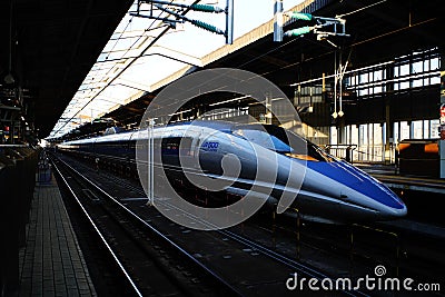 Scenic view of a blue Japanese high-speed train, the Shinkansen railway Editorial Stock Photo