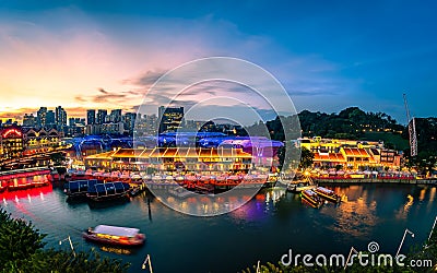 Scenic view of Clarke Quay with Bumboat cruising in Singapore River Editorial Stock Photo