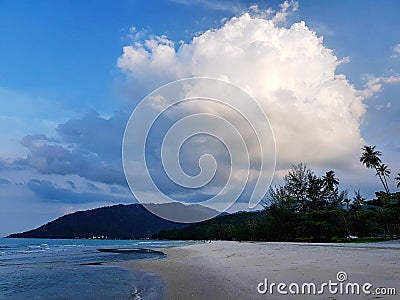 Scenic view of coastline against sunset sky Stock Photo