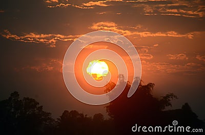 Scenic view dramatic beautiful sunset sky. Natural Sunset Sunrise on meadow silhouette shadow dark land. Vibrant dramatic sky on Stock Photo