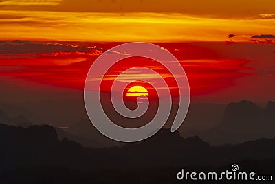 Scenic view dramatic beautiful sunset sky. Natural Sunset Sunrise on meadow silhouette shadow dark land. Vibrant dramatic sky on Stock Photo