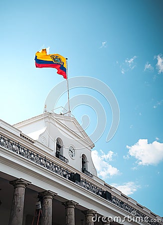 Scenic view of the Ecuadorian National flag on Carondelet Palace at Independence Square in Ecuador Stock Photo